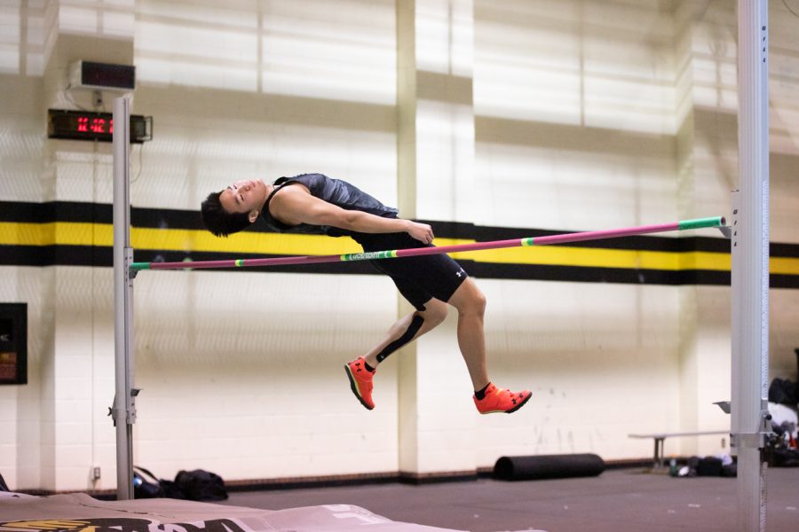 An athlete performs in the high jump during the track and field event on Jan. 13.