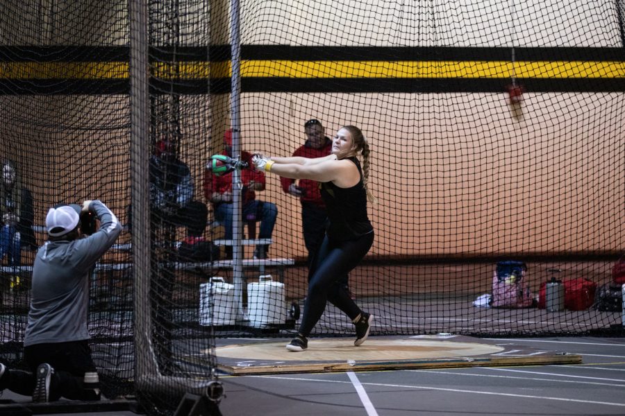 Sophomore+Anna+Zimmer+builds+up+momentum+before+releasing+her+weight+in+the+weight+throwing+compeitition+during+the+track+and+field+meet+on+Jan.+13.