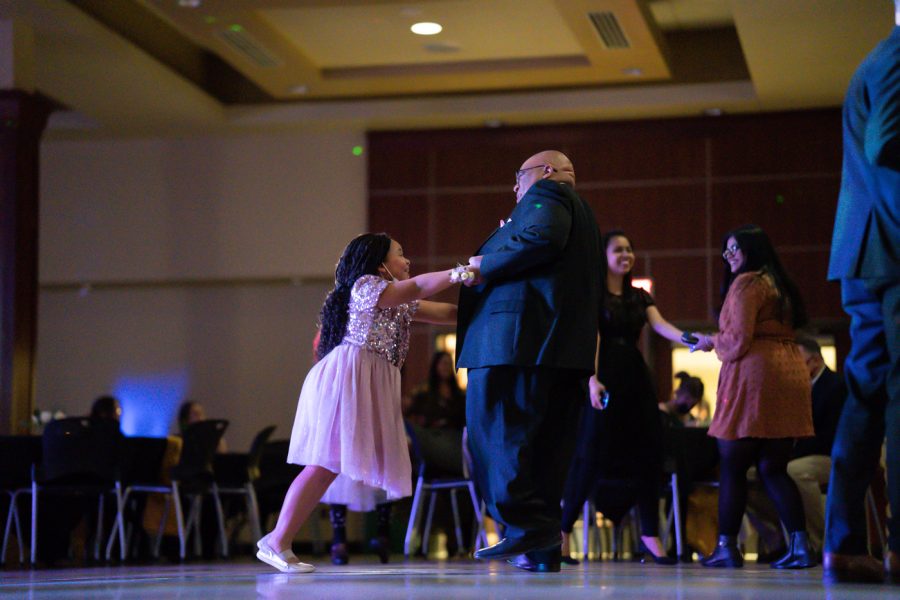 Associate Vice President for Student Affairs, Aaron Austin, dances with his daughter at Fairmount Formal. The event was hosted by SAC on Feb 19 at the RSC.