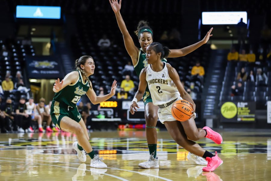 Senior Mariah McCully drives to the basket during the game against USF at Charles Koch Arena on Feb. 24.
