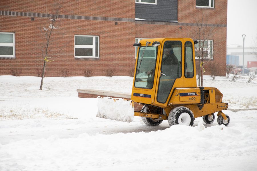 Wichita State snowplow driver keeping the sidewalk safe for students on Wednesday, Feb. 2. On snow days the drivers clear all sidewalks on campus.