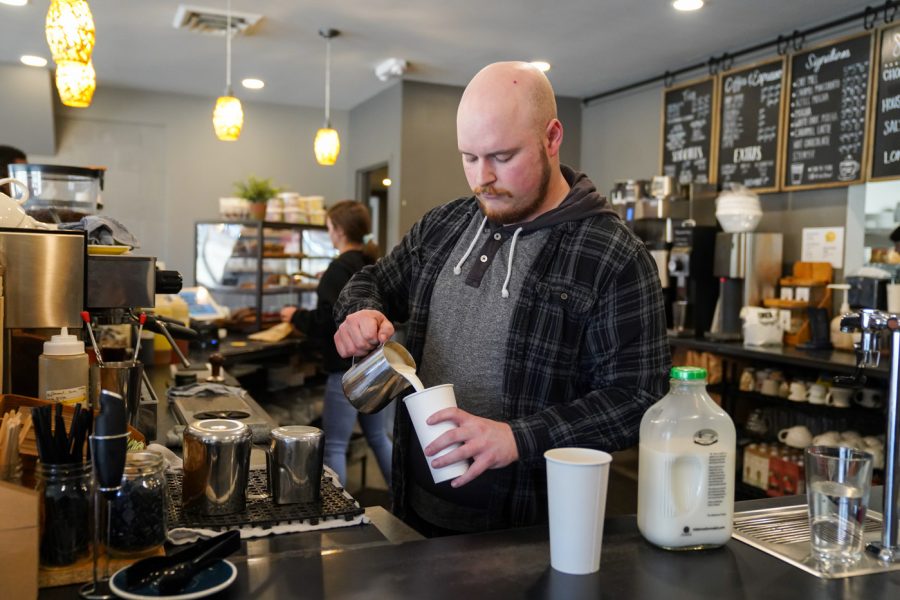 Brett+Foraker+pours+the+Milk+to+make+the+coffee+at+Fairmount+Coffee+Company+on+Mar+8th.