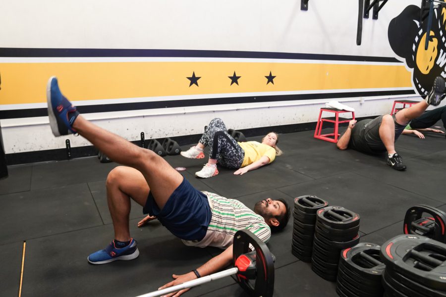 Kaustub does warmup exercise before the class at F45 on March 22nd at Heskett Center.