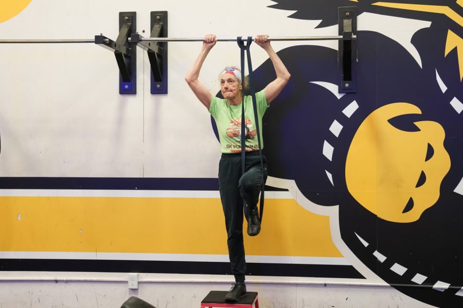 Elizabeth Berhrman does her pull ups at F45 on March 22nd at Heskett Center.