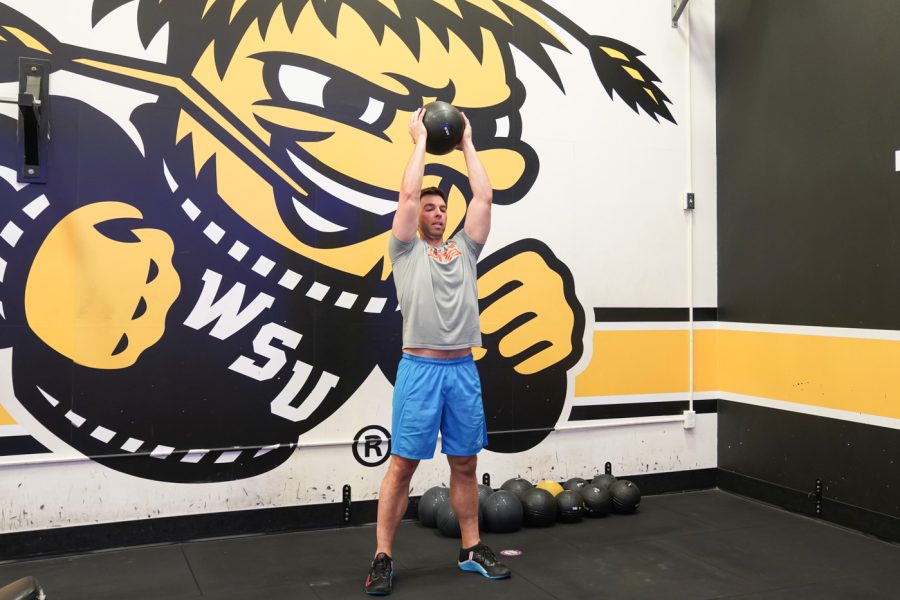 Clint Carrier lifts the weight ball  at F45 on March 22nd at Heskett Center.