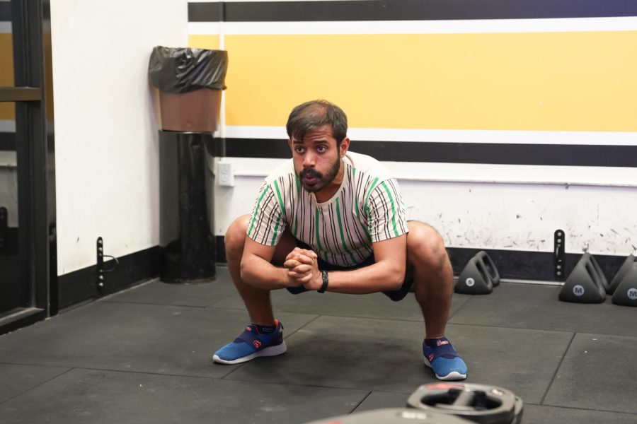 Kaustub does the squats at F45 on March 22nd at Heskett Center.