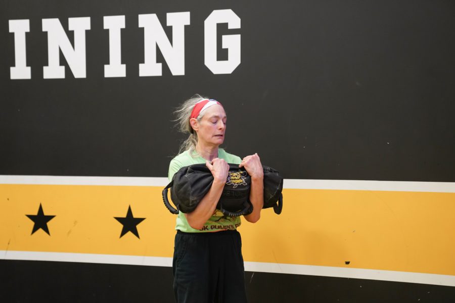 Elizabeth Berhrman lifts the weights at F45 on March 22nd at Heskett Center.