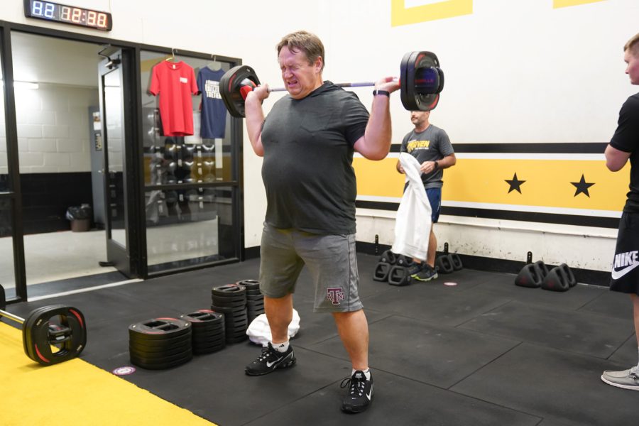 Man does the shoulder exercise at F45 on March 22nd at Heskett Center.