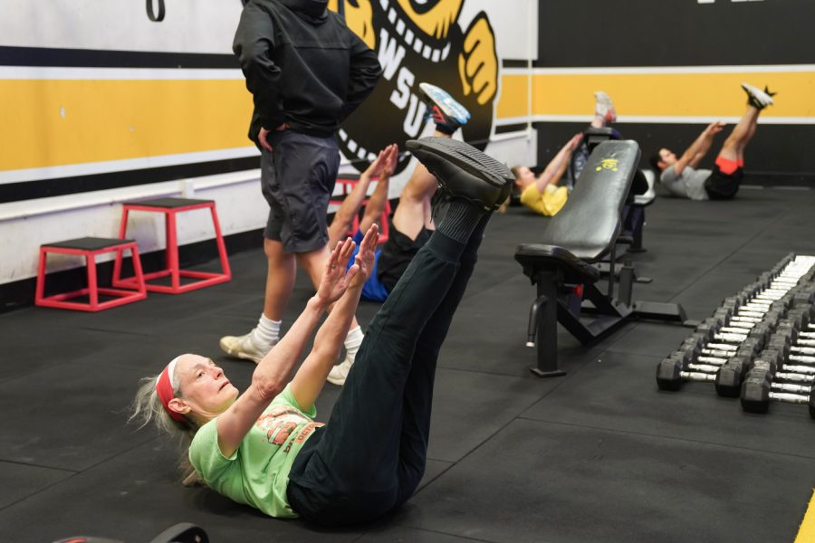 Elizabeth Berhrman does the warm up exercise at F45 on March 22nd at Heskett Center.
