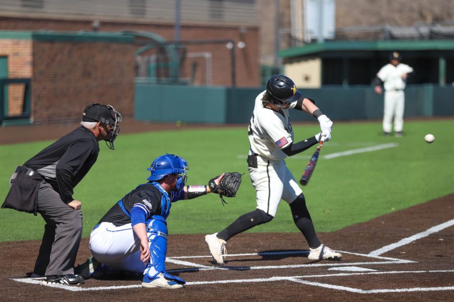 Jack Sigrist takes a swing during WSUs game against South Dakota State on March 13 inside Eck Stadium.