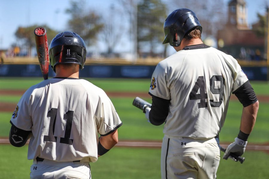 Ross Cadena and Payton Tolle wait for a pitcher to warm up during WSUs game against South Dakota State on March 13 inside Eck Stadium.