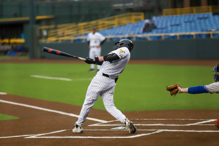 Andrew Stewart takes a swing during WSUs game against Kansas on March 23 inside Eck Stadium.