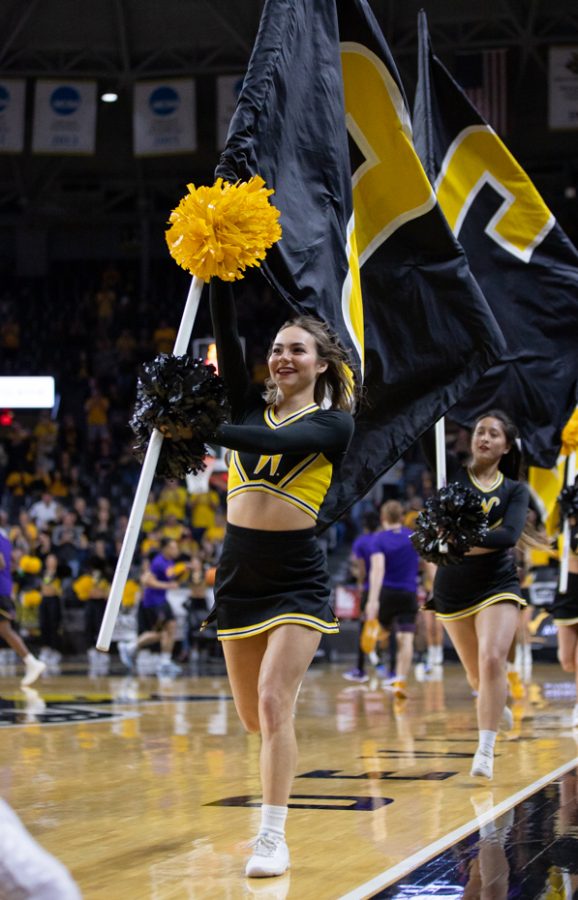 Following the removal of the mask mandate on March 3, the Shocker Spirit Squad enters Koch Arena unmasked before the mens basketball game against East Carolina on March 5, 2022.