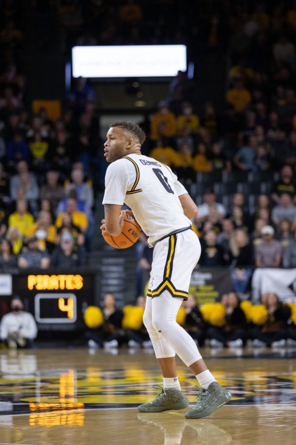 Junior Dexter Dennis looks for a teammate to pass the ball to on March 5 in Koch Arena. The Shockers defeated the East Carolina Pirates, 70-62.