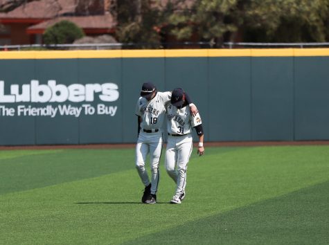 Redshirt freshmen Jordan Rogers and Will Carpenter walk off the field together before the game against the Creighton Bluejays on March 27 in Eck Stadium.