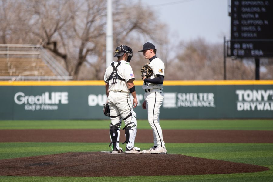 Senior catcher Ross Caden and sophomore pitcher Cameron Bye talk in between innings on March 27 during the game against the Creighton Bluejays.