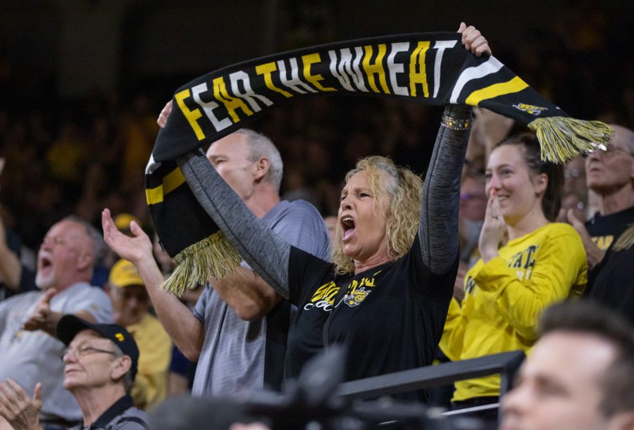After+a+slam+dunk+by+freshman+Ricky+Council+IV%2C+Shocker+fans+cheer+on+the+mens+basketball+team+in+Koch+Arena.+Wichita+State+defeated+East+Carolina%2C+62-70.%2C+on+March+5.