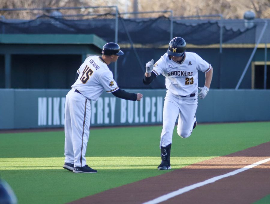 Seth Stroh celebrates with assistant coach Mike Sirianni after his home run during WSUs game against Creighton on March 25 inside Eck Stadium.