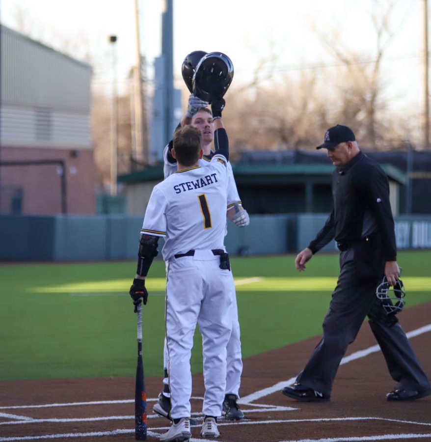 Seth Stroh celebrates with Andrew Stewart after his home run during WSUs game against Creighton on March 25 inside Eck Stadium.