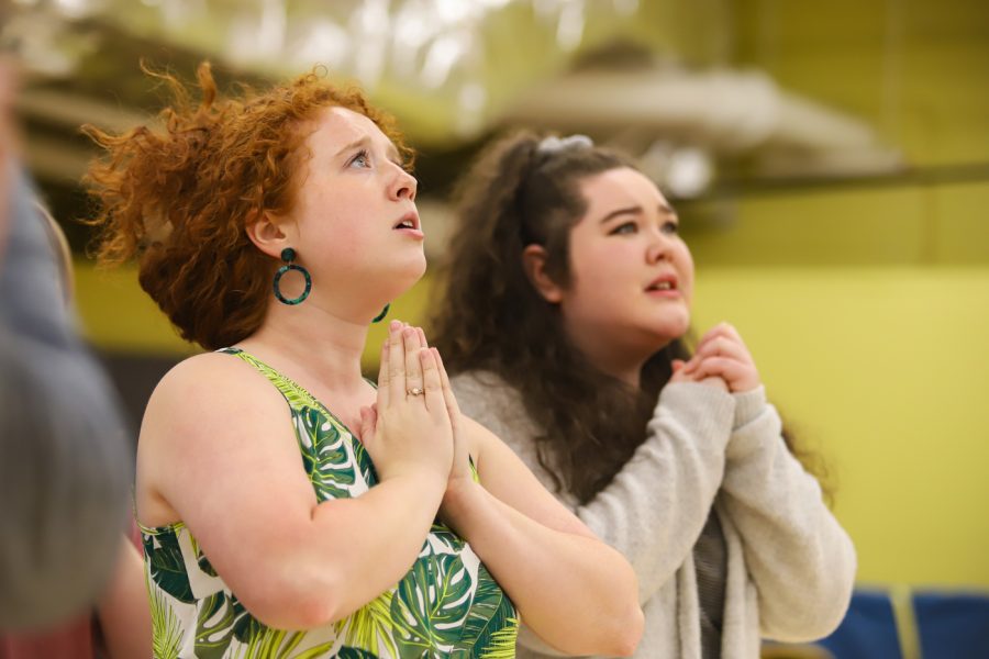 Chorus member, Madison Roths, prays with the villagers that Hester’s sins will not bring evil into the community. Roths and the villagers bombarded Minister Arthur Dimmesdale to reveal Hester’s punishment.
