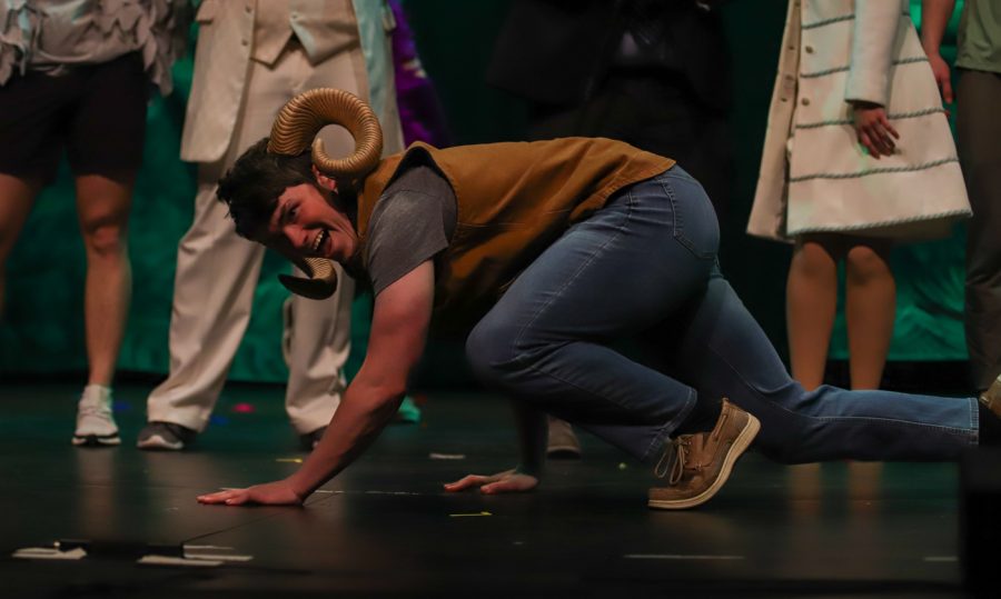 Beta Theta Pi member does the crawl during one of lip singing songs at the Hippodrome set up by Student Activities Council on April 8.