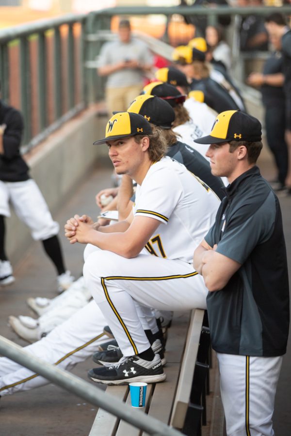 Freshman Ty Howry sits on the bench in the dugout while WSU bats during the game against OSU on April 26.