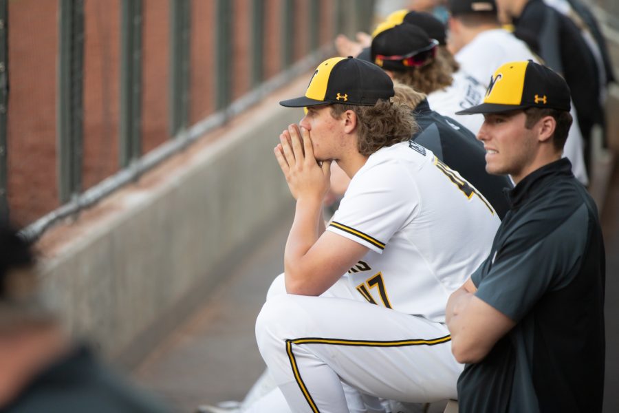 Freshman Ty Howry sits on the bench in the dugout while WSU bats during the game against OSU on April 26.