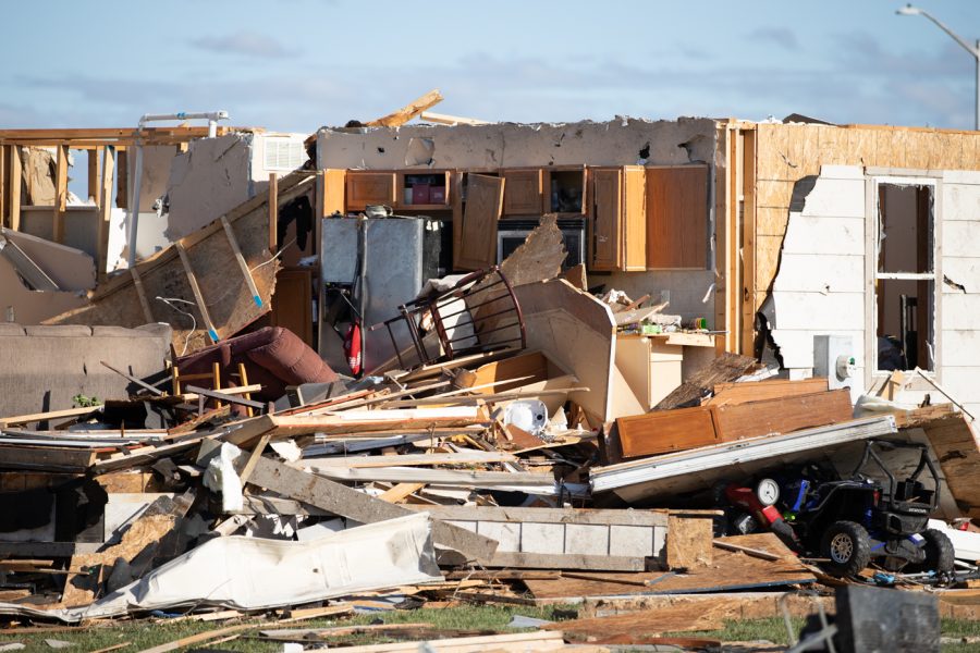 A destructive tornado wrecked a local neighborhood in Andover, Kansas. Neighborhood residents spent the entire morning looking through debris helping loved ones.