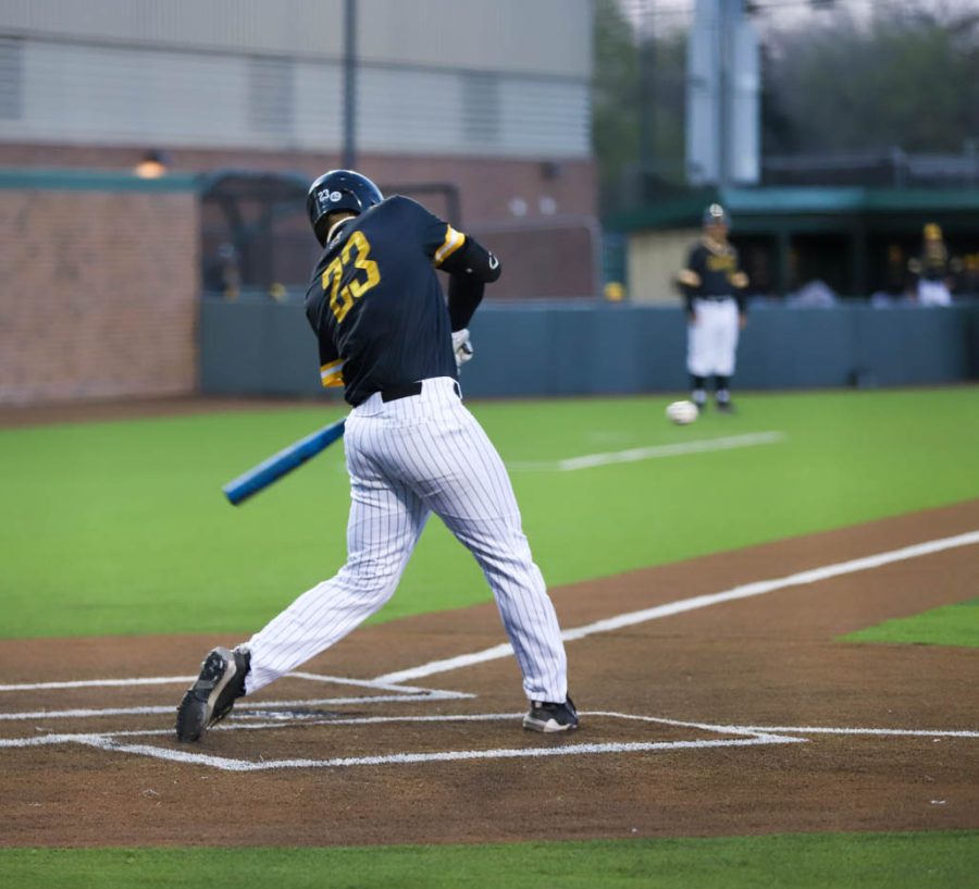 Sophomore Seth Stroh takes a swing during WSUs game against Kansas State on April 18 at Eck Stadium.