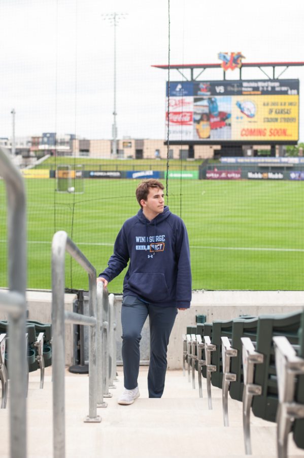 Sports management major Brett Farrar stands inside Wind Surge during his shift. Farrar worked as a promotions intern for the Wichita Wind Surge.