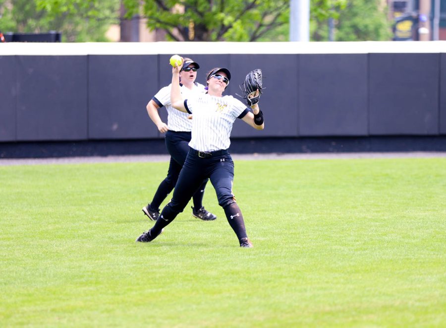 Sophomore Lauren Lucas throws the ball from center field during WSUs game against UCF on May 8 at Wilkins Stadium.