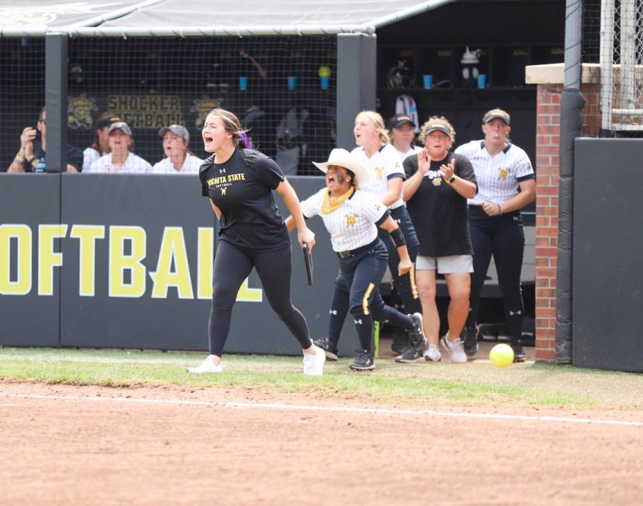 Director of Operations Nicole Pendley celebrates after a key out during WSUs game against UCF on May 8 at Wilkins Stadium.