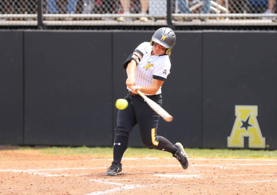 Freshman Cassie Passwaters takes a swing during WSUs game against UCF on May 8 at Wilkins Stadium.