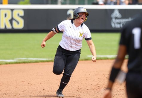Freshman Cassie Passwaters celebrates after launching a pinch-hit homer during WSUs game against UCF on May 8 at Wilkins Stadium.