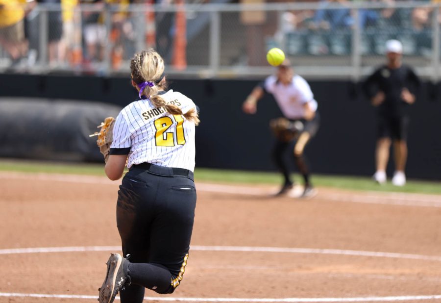 Freshman Krystin Nelson fires the ball toward first base during WSUs game against UCF on May 8 at Wilkins Stadium.