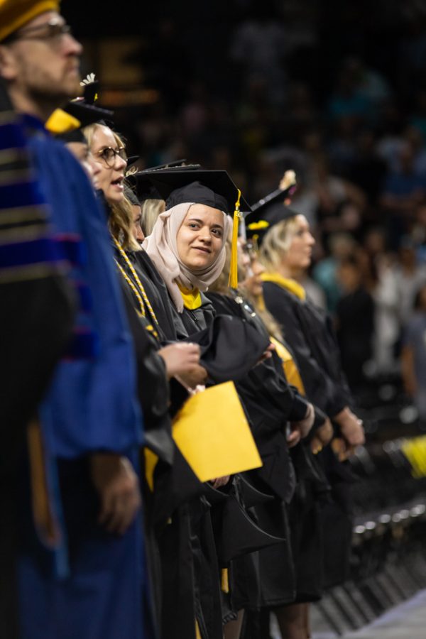 Graduates stand together during the first 2022 Spring Commencement Ceremony on May 14.