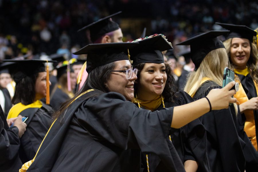 Graduate students take a picture together before the start of the first 2022 Spring Commencement Ceremony.
