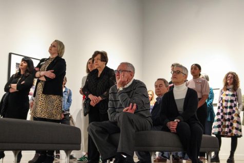 Ulrich Museum directors and museum-goers listen to the Dean of College of Fine Arts Rodney Miller introduce the speakers. The summer exhibition opening was held on May 26, 2022.