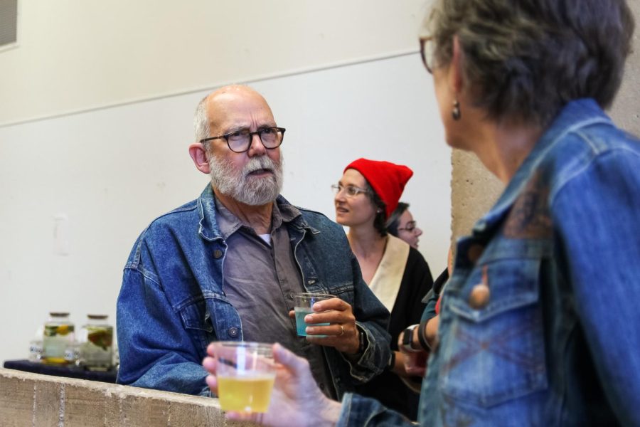 Museum-goers talk and enjoy their drinks at the Ulrich Summer 2022 Exhibition opening on May 26.