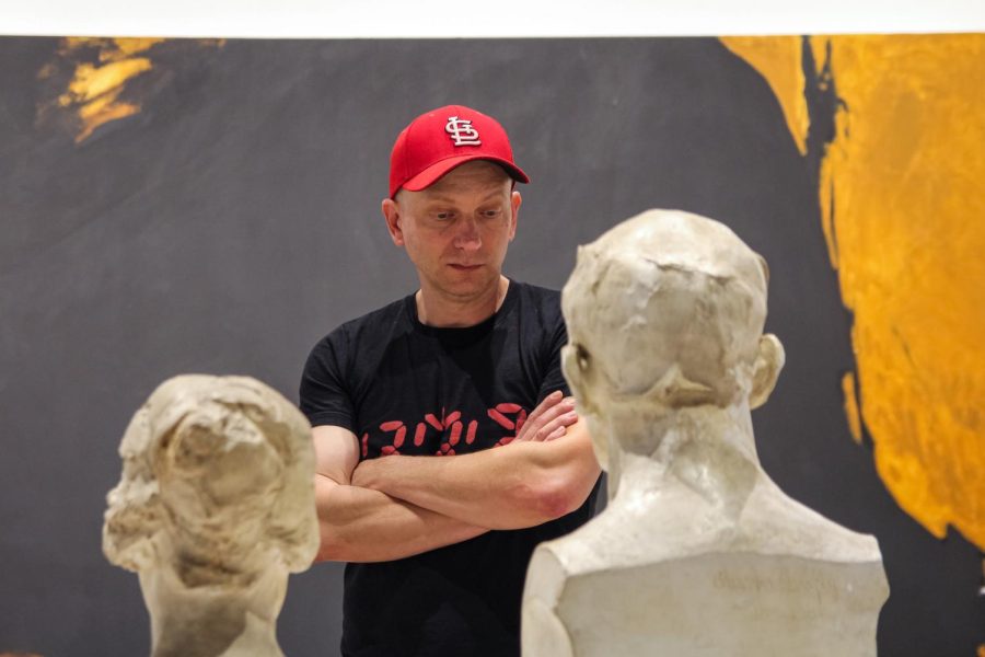 Museum-goer observes the sculptures and art at the Ulrich Summer 2022 Exhibition opening on May 26.