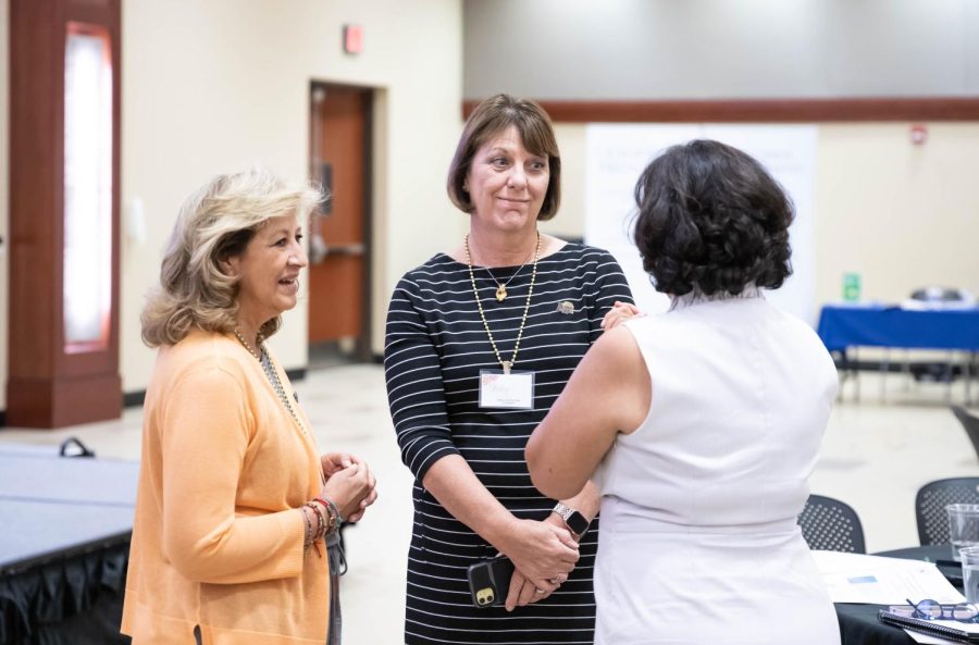 Shirley Lefever, executive vice president and provost talking with other participants at the Latina leadership summit.