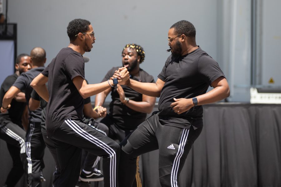 Alpha Phi Alpha members compete in the Riverfest Stroll Off Competition. The event was a historical and cultural component of Black and multicultural Greek life, where teams danced to crease a unified whole.