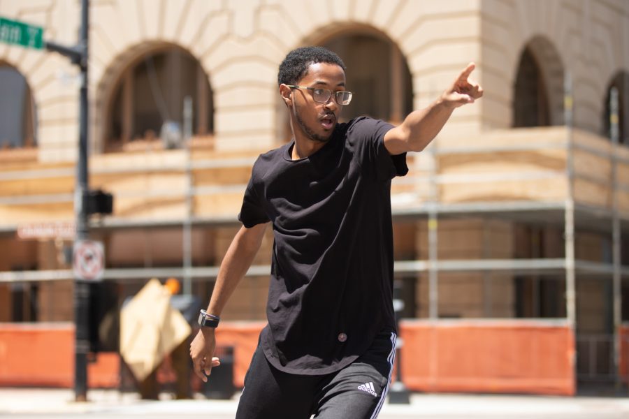 An Alpha Phi Alpha member competes in the Riverfest Stroll Off Competition on June 5.