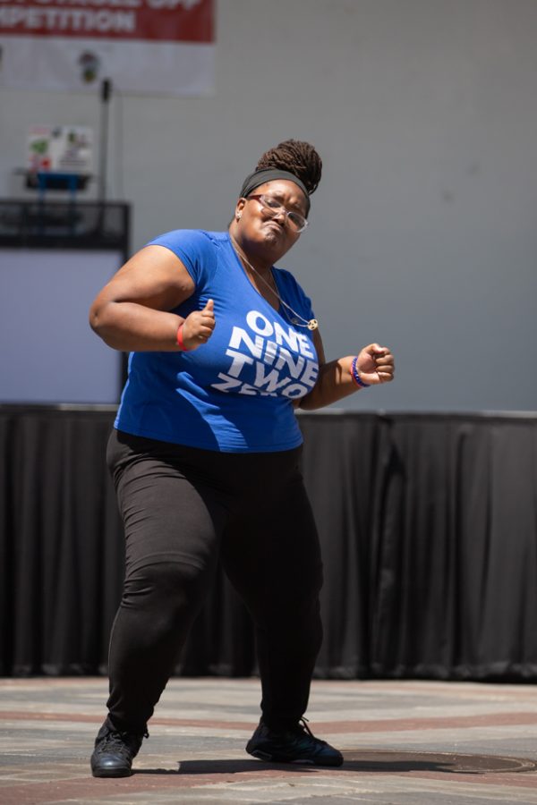 A Zeta Phi Beta member performs for the crowd at Riverfest on June 5 during the Stroll Off Competition.