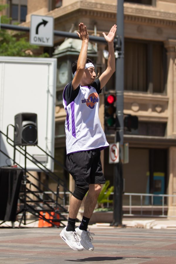 A Sigma Lambda Beta member dance during the Stroll Off Competition during Riverfest on June 5.