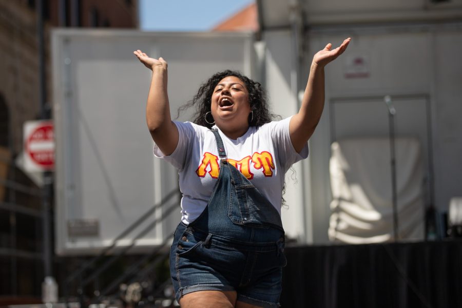 A Lambda Pi Upsilon member hypes up the crowd at the Stroll Off Compeition during Riverfest.