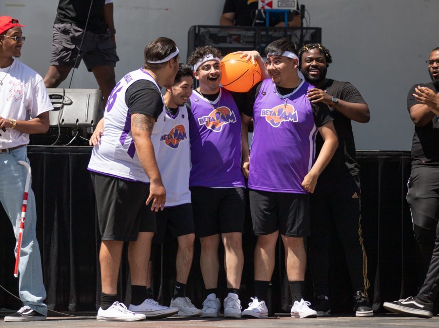 Sigma Lambda Beta members celebrate together after winning the Stroll Off Competition at Riverfest on June 5.