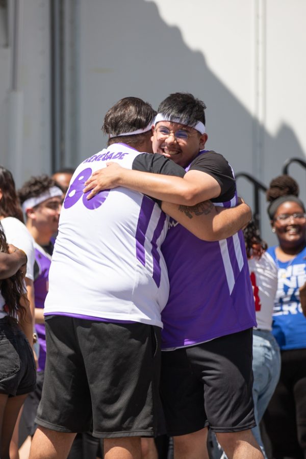 Sigma Lambda Beta members celebrate together after winning the Stroll Off Competition at Riverfest on June 5.