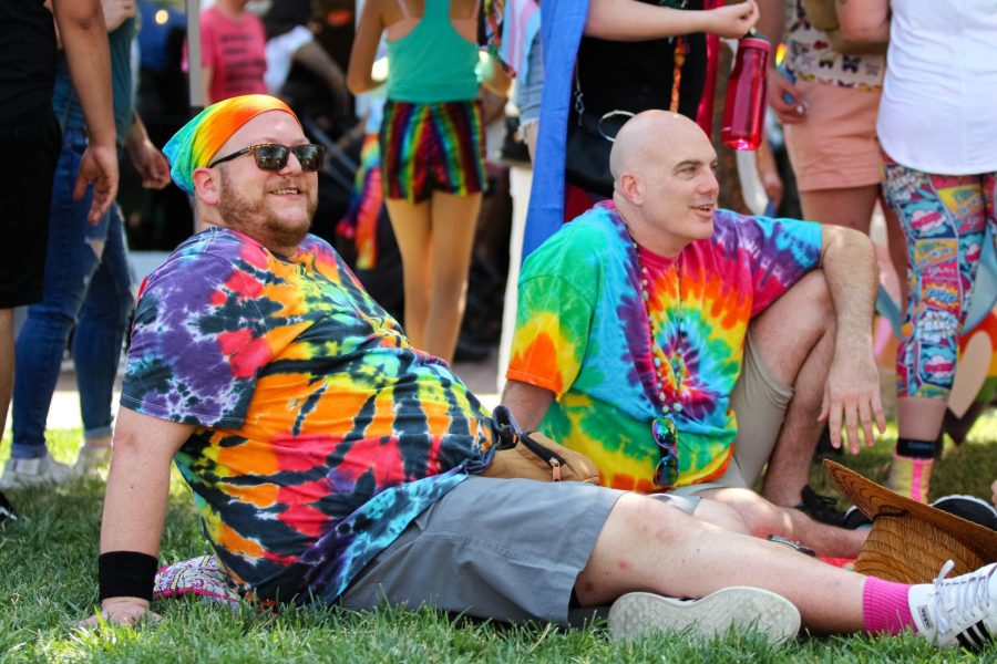 Pride event goers rest and watch the performances at Naftzger Park during the Family Picnic held on June 25, 2022.