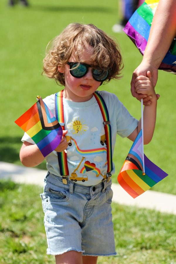 Pride event goer dressed up in rainbow accessories for the Unity March and Family Picnic event on June 25, 2022.
